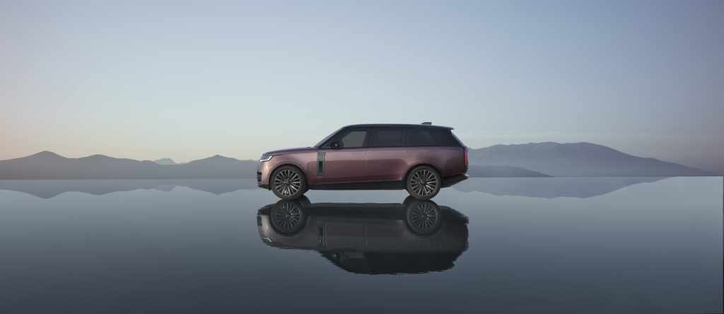 2027 Range Rover Electric side profile reflected on still water at Land Rover Solon in Solon, OH