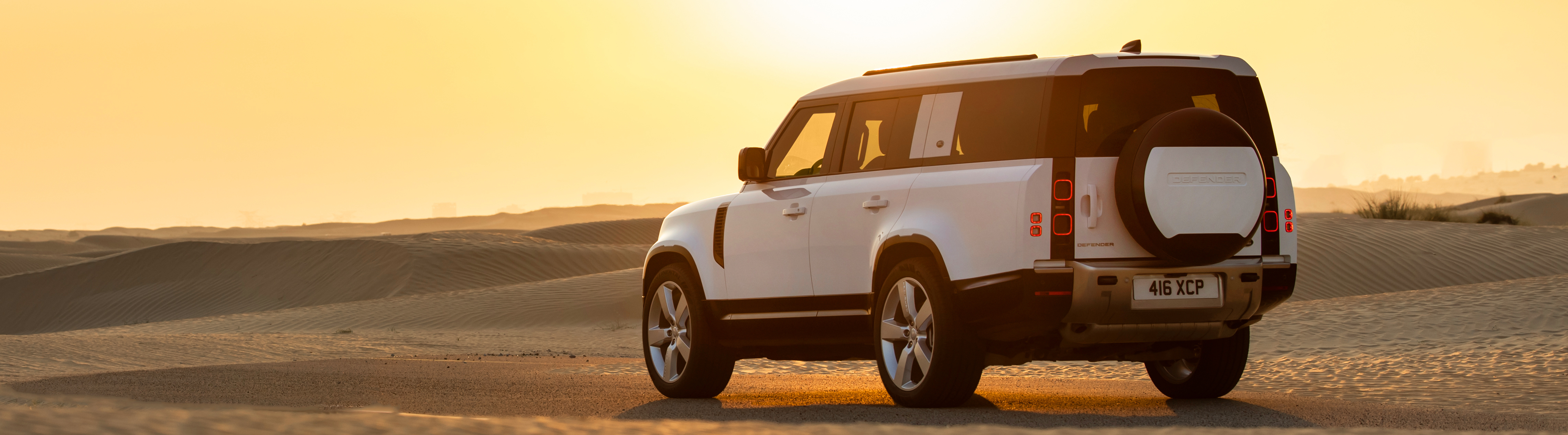 Location Image in Dubai of the New Defender 130 SE P400 in Fuji White