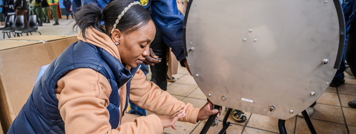 JLR colleagues and The Washing Machine Project demonstrating how to assemble the Divya Washing Machine