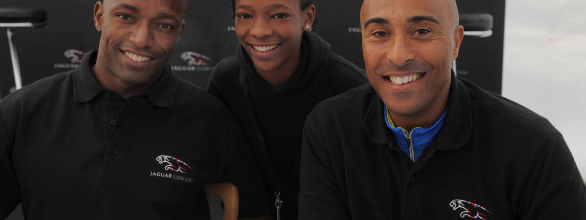 Jaguar Academy of Sport's Marlon and Colin with local child