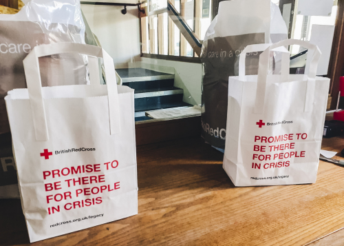 British Red Cross Volunteers from Bristol use Land Rover Defenders to deliver support packages for those in need